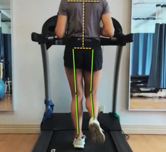 Runner mid-stride captured from behind for gait analysis