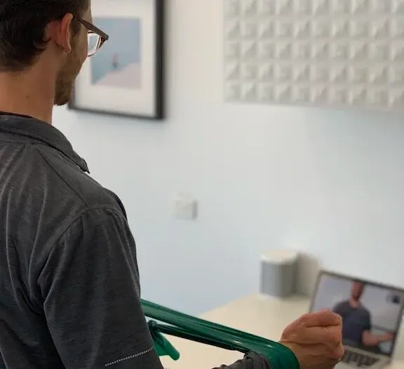 Therapist conducting a virtual physiotherapy consultation via video call